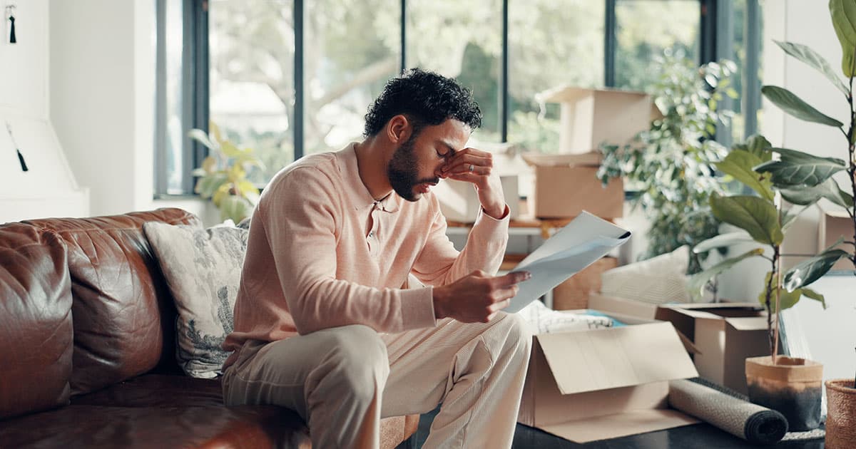 Homeowner reviewing solar loan payments and bills at home